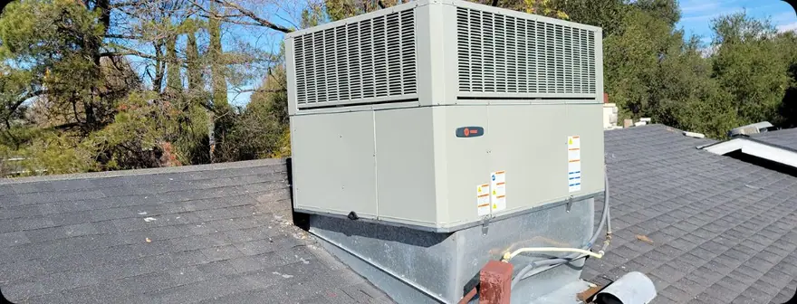Residential HVAC equipment on a home roof